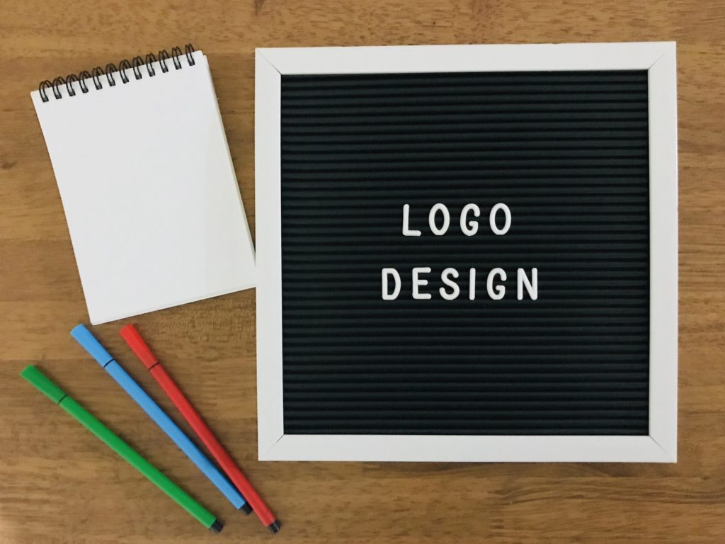 Logo Design on wooden background 100